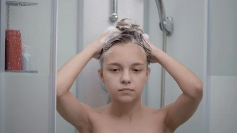 Teen girl bathing under shower | Stock Video 
