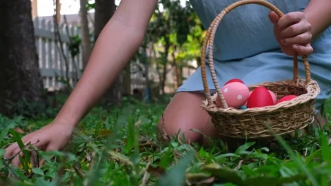 Teen girl collects Easter eggs  Stock Footage 170532853