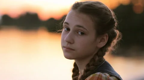 Teen girl face serious looking at camera... | Stock Video | Pond5