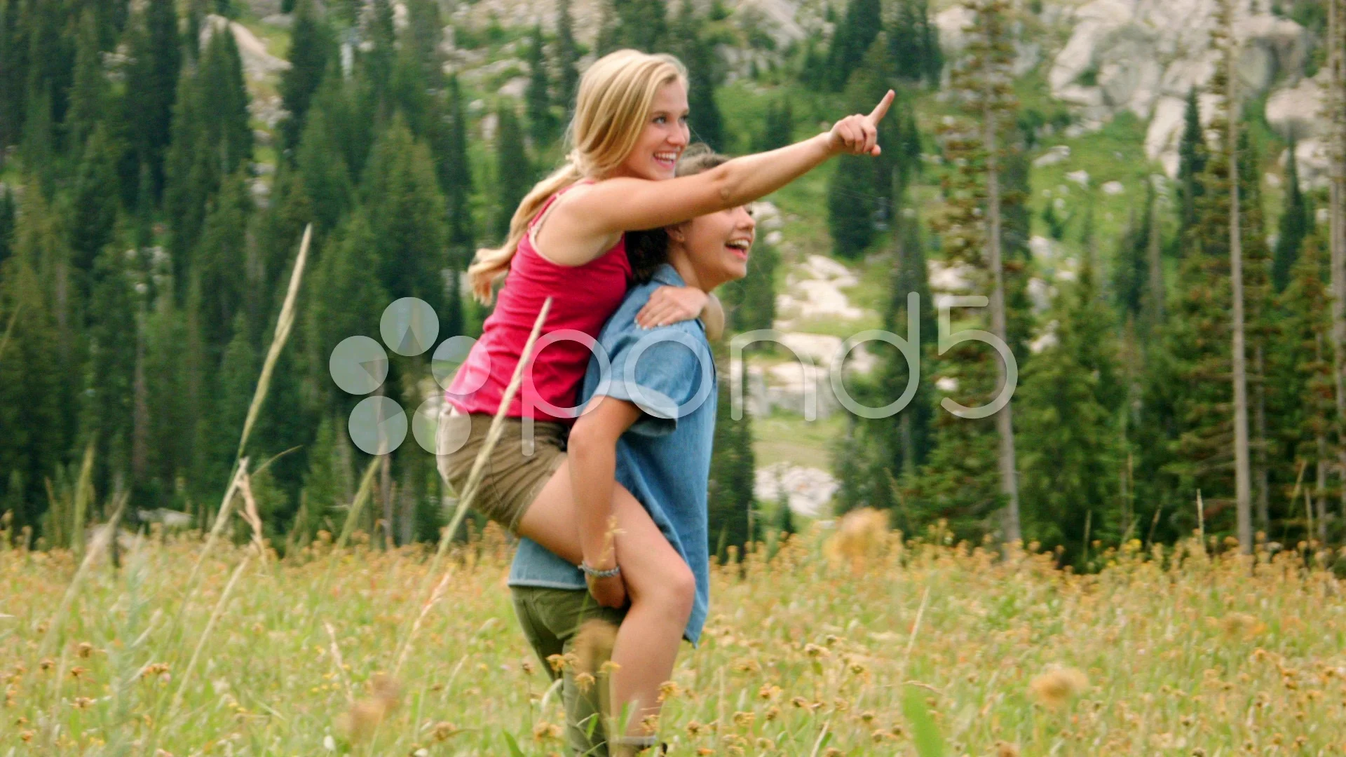 Teenage girl giving friend piggyback ride Stock Photo - Alamy