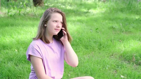 Teen girl talking on her mobile cell phone. Technology, communication and Stock Footage