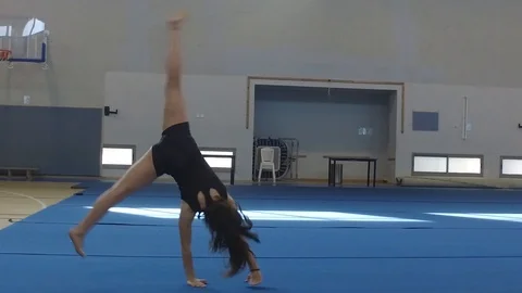 Teen Gymnastics practice sequence side dolly Stock Footage 106042278