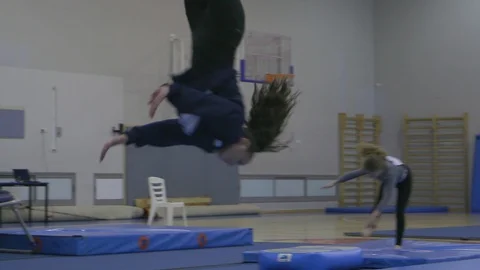 Teen gymnastics pro exercise sequence training Stock Footage 106041385