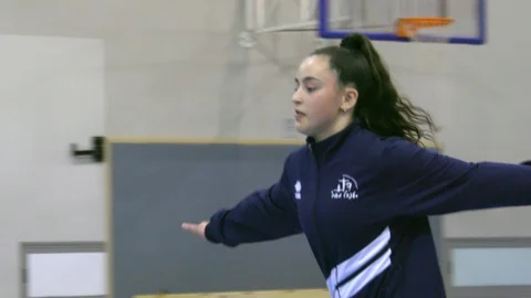 Teen gymnastics pro exercise sequence medium shot Stock Footage 106041801