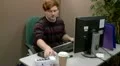 Teen office worker answers a telephone call HD Footage