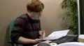 Teen office worker checking files HD Footage