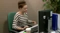 Teen office worker has a computer problem HD Footage