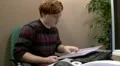 Teen office worker relieved to find information in files HD Footage