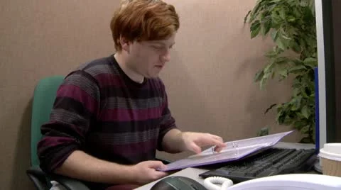 Teen office worker relieved to find information in files Stock Footage