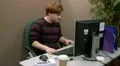 Teen office worker struggling to find information in files HD Footage