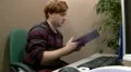 Teen office worker struggling to find information in files HD Footage