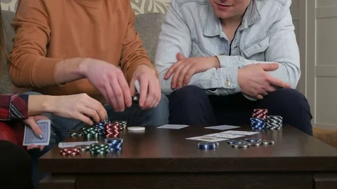 Teen poker players betting chips in poker game Stock Footage