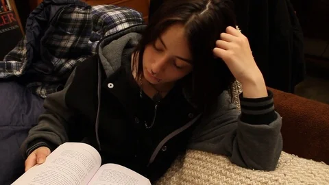 Teen reading book Stock Footage 78961736