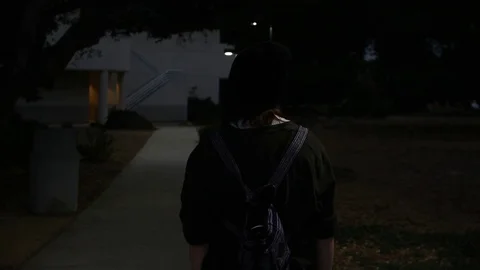 Teen at school/night Stock Footage 79334450