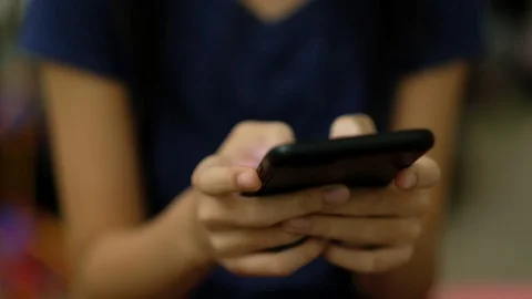 Teen sending message using smart phone Stock Footage 104168888