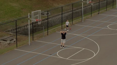 Teen shooting three pointer hits nothing but net 스톡 동영상 120804560