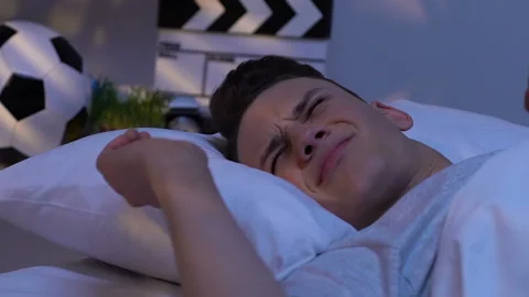Teen sleeping in bed, problem with waking up, sleepless night, oversleeping Stock Footage 105143938
