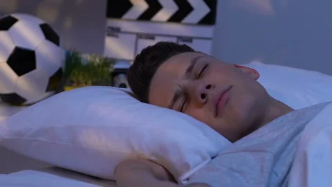 Teen sleeping in bed, problem with waking up, sleepless night, oversleeping Stock Footage 105145569