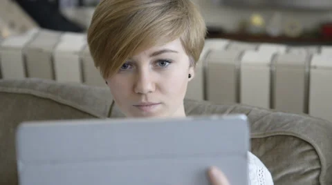 Teen on Tablet with Surprised Expression Stock Footage 34088237