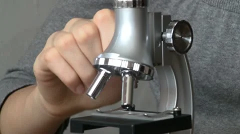 Teen using microscope Stock-Footage 11380120