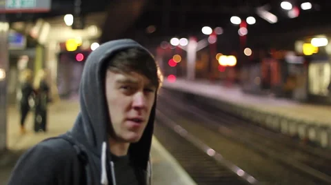 Teen waiting edge of Platform for Train Stock Footage 40679565