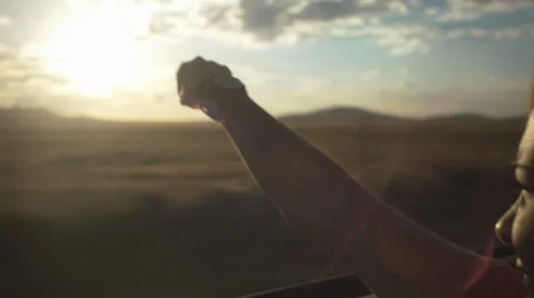 Teen Waves Her Hand In The Wind In A Convertible Stock Footage