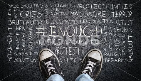 Teen Wearing Canvas Shoes on Asphalt With # Enough Word Cloud Stock Photos