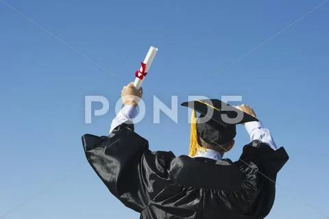 Teenage boy (16-17) at his graduation ceremony Stock Photos