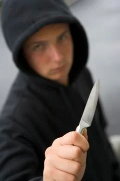 Teenage boy branding knife Stock Photos