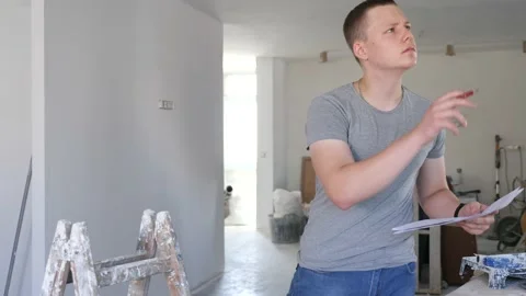 Teenage boy checking documents in construction site during workday on part-time Video stock 221735954