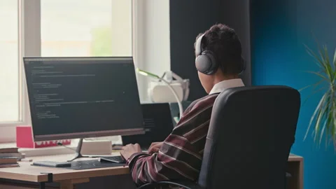 Teenage Boy Checking Script on Computer while Coding at Home Stock Footage 319736038
