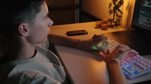 Teenage Boy Coding on Laptop at Night 库存影片 344967876