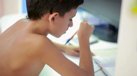 Teenage boy doing homework using a cell phone. natural video Stock Footage 67362205