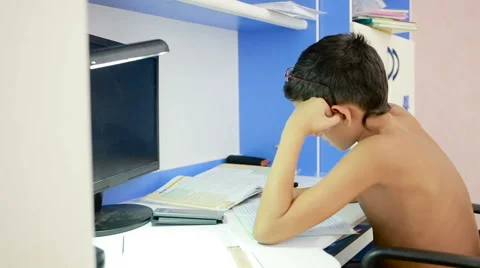 Teenage boy doing homework using a cell phone. natural video Stock Footage 67545011