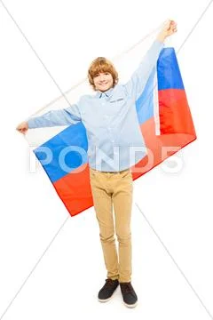 Teenage boy in full height waving Russian flag Stock Photos