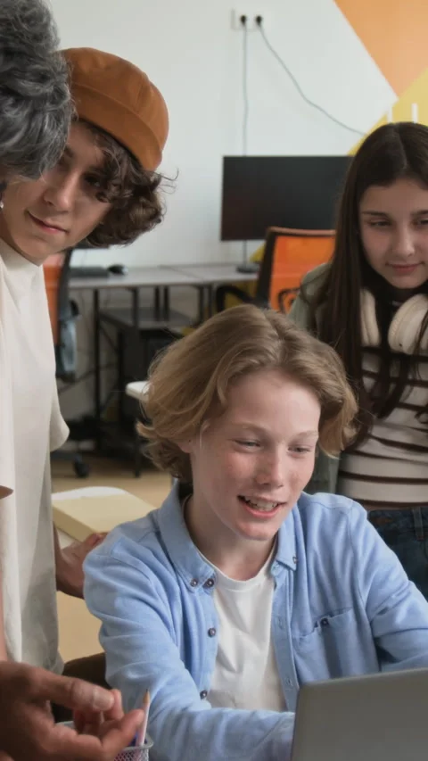 Teenage Boy Learning Coding on Laptop with Teacher in Stem Class Stock Footage 342823861