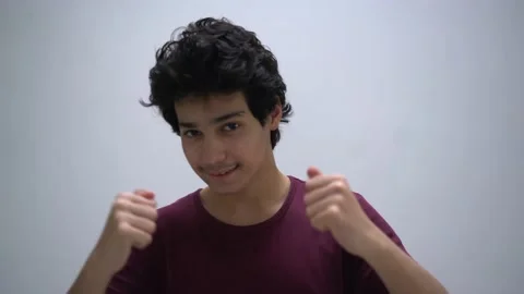 Teenage boy making gestures Stock Footage 132069575