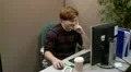 Teenage boy messing around in the office HD Footage