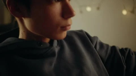 Teenage boy playing a computer game at night on a backlit keyboard. Stock Footage 336316766