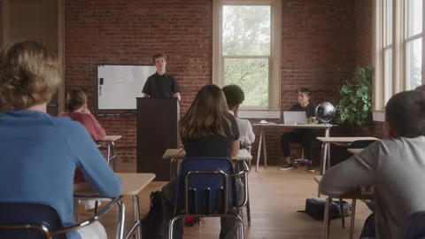 Teenage Boy Stands at Classroom Podium G... | Stock Video | Pond5