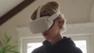 Teenage Boy Wearing Virtual Reality Goggles Looks Around In Cyberspace At Home Stock Footage