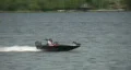 Teenage boys speed by in motor boat HD Footage
