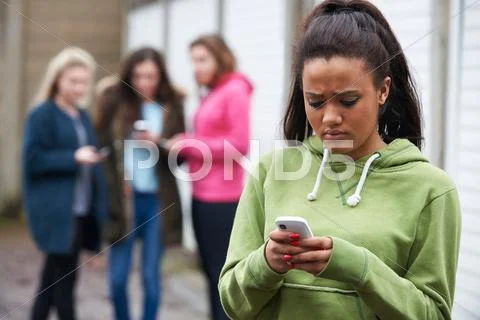 Teenage Girl Being Bullied By Text Message Stock Photos