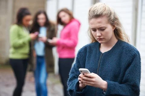 Teenage Girl Being Bullied By Text Message Stock Photos