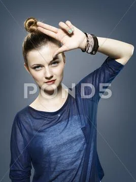 Teenage girl doing loser hand sign Stock Photos