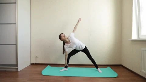 Teenage girl doing yoga at home, Stock Video Pond5