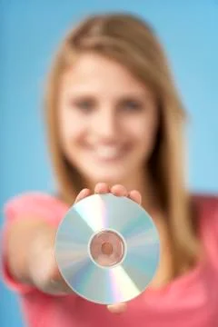Teenage Girl Holding DVD Stock Photos