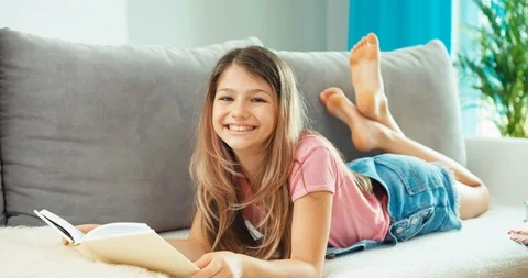 teen girl reading a book