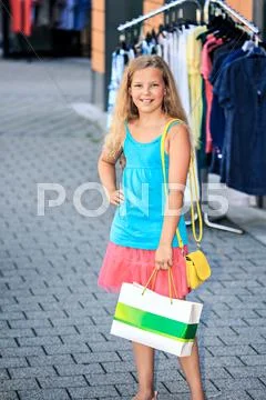 Teenage girl shopping in an european city Stock Photos