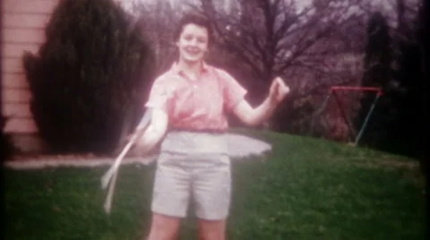 teenage girl twirls her baton in the bac... | Stock Video